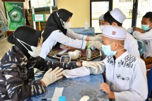 Lanal Banjarmasin Tuntaskan Vaksinasi Covid-19 di Pondok Pesantren Darul Ilmi
