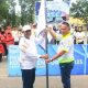 Wakil Bupati Tanah Laut H. Muhammad Zazuli melepas kontingen Forda Kalsel di Stadion Pertasi Kencana, Pelaihari, Jumat (23/5/2025). (Dok. Pemkab Tala)