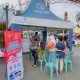 Petugas Polres Kotabaru melayani warga dalam kegiatan pelayanan publik saat CFD Siring Laut, Minggu (22/6/2025).