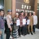 Petugas Polsek Astambul memediasi warga terkait penyalahgunaan uang sumbangan di area Makam Datu Kelampaian, Senin (14/7/2025).