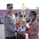 Kapolres Barito Kuala AKBP Anib Bastian menerima Piala Juara Umum dari Saka Bhayangkara Polres Batola dalam Apel Pagi di Mapolres Batola, Senin (21/7/2025).