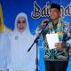 Wakil Bupati Tanah Laut, H. Muhammad Zazuli, menyampaikan sambutan pada acara Batamat Al-Qur’an dan Wisuda Akbar santri TK/TPA se-Kecamatan Pelaihari yang digelar di halaman Stadion Pertasi Kencana, Sabtu (26/07/2025).