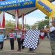 Plt Kepala Dispora Kalsel Fitri Hernadi melepas ribuan peserta Lomba Gerak Jalan HUT RI dan Hari Jadi Kalsel di Banjarbaru, Sabtu (9/8/2025).