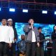 Wakil Ketua I DPRD Tanah Bumbu, H. Hasanuddin (kiri depan), bersama Bupati Tanah Bumbu, Andi Rudi Latif (tengah), saat Aksi Tanah Bumbu Bershalawat di Jalan Kodeco KM 2, Kecamatan Simpang Empat, Sabtu malam (9/8/2025).