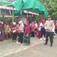 Kapolsek Tanta IPDA Aris Sufariyadi memimpin jajaran Polsek Tanta mengikuti jalan santai peringatan HUT RI ke-80 bersama warga Desa Puain Kanan.