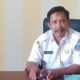 Kepala Desa Megasari Ali Mukhdin saat meninjau progres pembangunan jembatan penghubung desa yang ditargetkan selesai tahun ini.