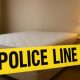 Garis polisi melintang di area kamar hotel tempat penggerebekan dilakukan oleh petugas kepolisian di Surabaya.