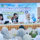 Kepala Dinas Kesehatan Tanah Bumbu Hj. Narni memberikan sambutan pada pertemuan koordinasi pembinaan Posyandu di Batulicin.