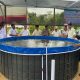 Kapolsek Marabahan menebar bibit ikan nila di kolam bioflok bersama pejabat daerah Barito Kuala untuk mendukung ketahanan pangan lokal.