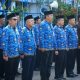Rudi Imtihansyah berdiri di podium Apel Gabungan ASN Pemkab Tanah Laut saat menyampaikan capaian Porprov dan persiapan Peparprov 2025.