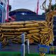 Patung Kijang Mas berwarna emas yang dibuat dari ratusan knalpot brong sitaan Polres Tanah Laut dipamerkan di stan Tala Expo 2025.