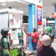 petugas spbu mengisi bbm ke kendaraan konsumen di sumatera