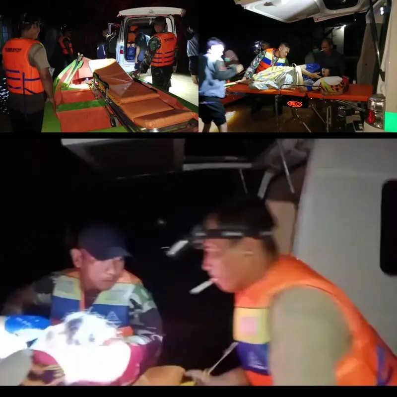 Polisi dan TNI mengevakuasi ibu hamil menggunakan perahu di tengah banjir Balangan pada dini hari.
