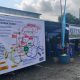 Petugas Sat Lantas Polres Tabalong memasang spanduk keselamatan lalu lintas bagi jemaah 5 Rajab di jalur utama Tabalong