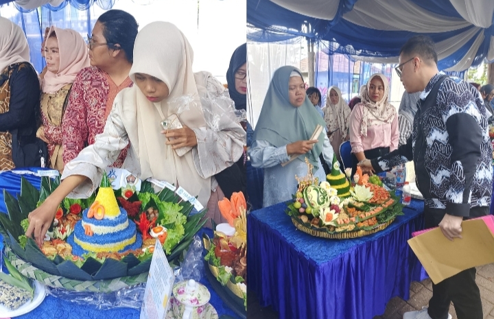 Peserta lomba menampilkan nasi tumpeng dalam festival budaya Hari Jadi Tanah Laut ke-60.