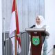 Sekretaris Daerah Tanah Bumbu Yulian Herawati menyampaikan pidato pada acara pelantikan Pengurus BKMT Tanah Bumbu 2025–2030.