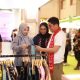 Bupati Tanah Bumbu melihat produk kerajinan UMKM di stan pameran INACRAFT 2026 bersama pelaku usaha.