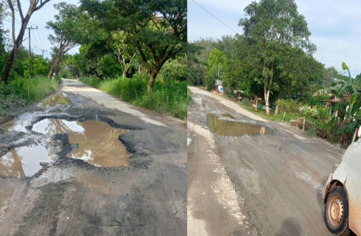Jalan Sungai Pinang–Pelaihari di Tanah Laut rusak parah dengan lubang besar dan genangan air yang membahayakan pengendara.