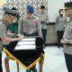 Prosesi penandatanganan berita acara pelantikan Kapolresta Sleman oleh Kombes Pol Adhitya Panji Anom disaksikan Kapolda DIY Irjen Pol Anggoro Sukartono.
