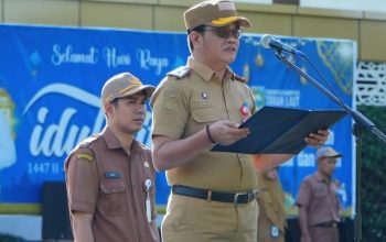 sekda tanah laut ismail fahmi memimpin apel gabungan asn dan membacakan sambutan bupati di pelaihari 6 april 2026