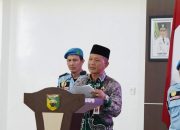 Pejabat pemerintah Tanah Laut menyampaikan sambutan dalam pelantikan pengurus BKPRMI di sebuah aula.