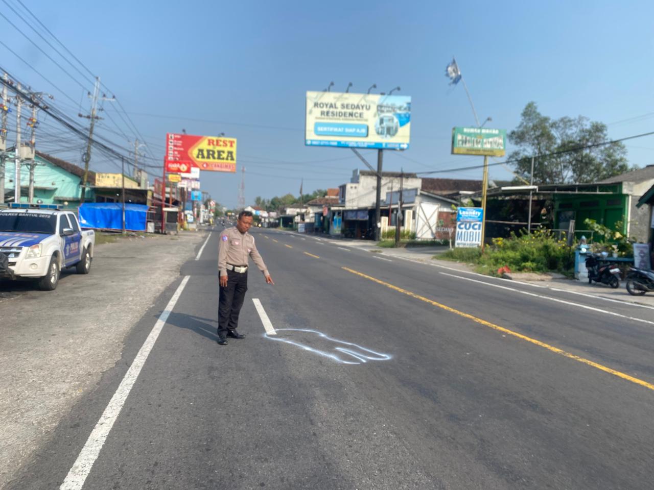 Polisi menunjuk ke jalan raya