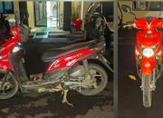 Motor matic merah di halaman kantor polisi